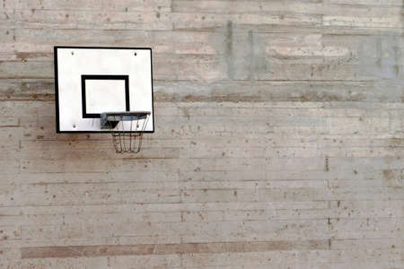 Cement wall with a basketball hoop with a lot of copy space.の写真素材