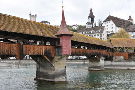 Lucerne, Switzerland 04 17 2021 Spreuer Bridge is wooden bridge or footbridge with roof over river...