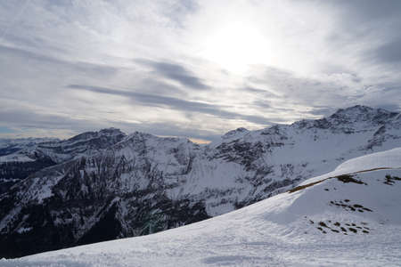 Winter landscape of snowcapped Swiss Alps in tectonic arena Sardona. Panoramic view from Pizol...