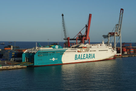 Barcelona, Spain - 06 09 2022: Ro-Ro, passenger ship operated by the Spanish company BALEARIA moored in Barcelona during loading cars and lories. Vessel operated with an LNG-powereのeditorial素材