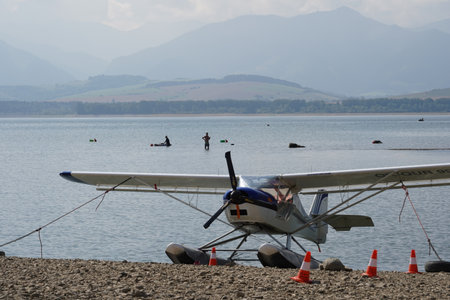 Front view on floatplane or seaplane with two slender floats mounted under the fuselage to provide...