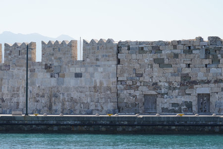 City fortifications in city of Kos on the seashore. The stone walls are erected almost on the water...