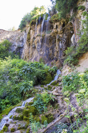 Waterfall on mountain river in Carpathian Mountains , Romaniaの写真素材