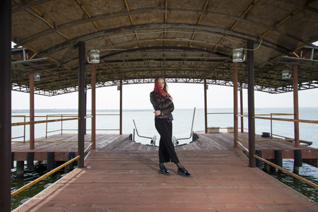 Young girl posing on pier at Lake Siutghiolの写真素材