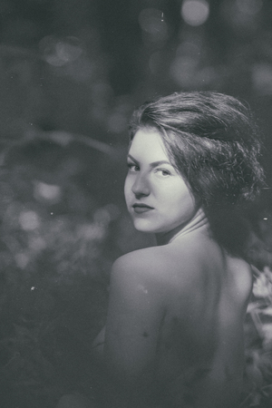 Pretty young girl posing outdoor in a forestの写真素材