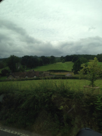 View on the road in the countryside from inside a car moving fast.