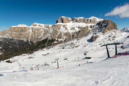 Ski slopes and lifts at ski resort in Italian Dolomites