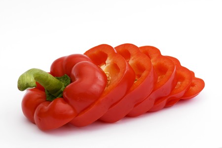 sliced red pepper isolated on a white backgroundの写真素材