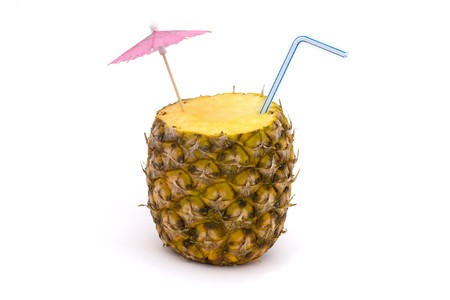 pineapple with straw and umbrella on a white backgroundの写真素材