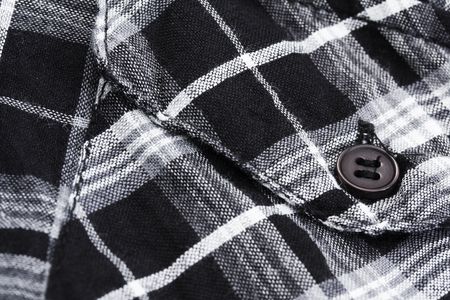 macro of black and white checked shirt pocketの写真素材