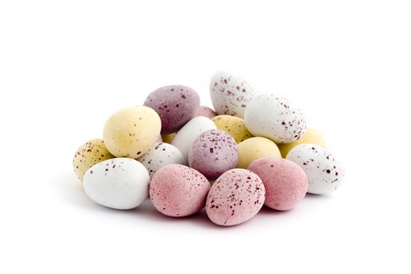 Pile of chocolate easter eggs over a white background