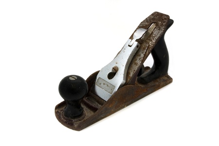 Old rusty wood plane isolated on whiteの写真素材