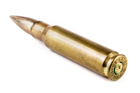 Single rifle bullet over whiteの写真素材