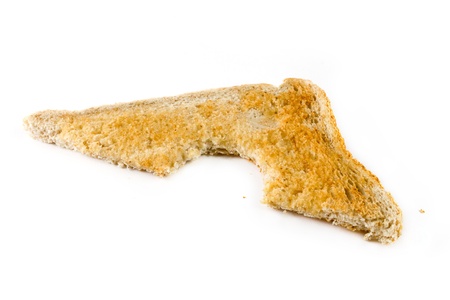 Slice of toast with a missing bite over white