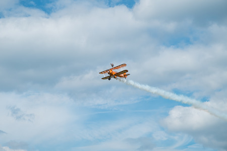 ASCOT, UK - AUGUST 16, 2014: Wing walking display at the Red Bull Air Race in Ascot, August 16,...