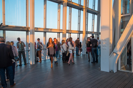 LONDON, UK - OCTOBER 3, 2014: Visitors on the viewing platform in The Shard, the tallest building in London at sunset in October 2014.のeditorial素材