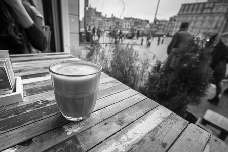 Coffee on a table in a coffe shop window.の写真素材