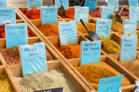Collection of spices for sale at a market.
