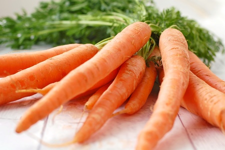 Carrots on the white background, front horizontal viewの写真素材