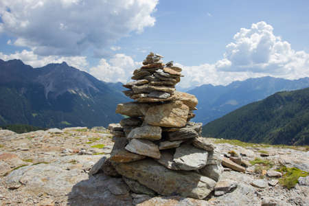 Cairn on the top of a mountain in Switzerlandの写真素材