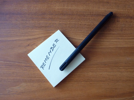 a yellow office paper reminder with a message