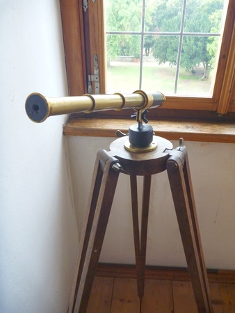 a well preserved old hostoric binocular at the window