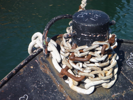 a strong rusty chain in a port