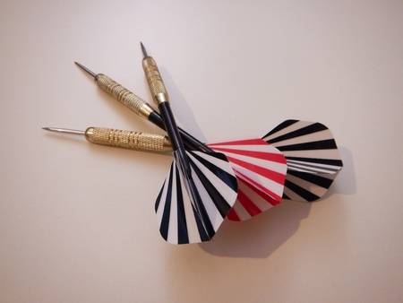 red and black darts on a simple white background