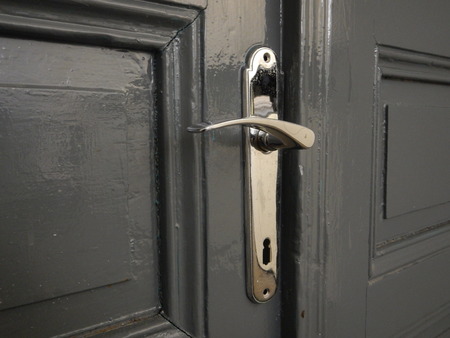 a detail of an old metal door handleの写真素材