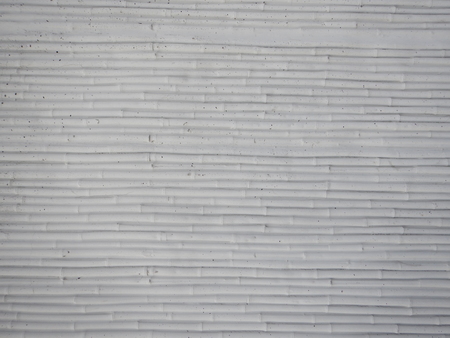 a detail of a white structured plaster textureの写真素材