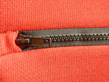 a detail of a zipper on a fabric