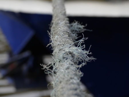 a detail of a shybby rope for a boat