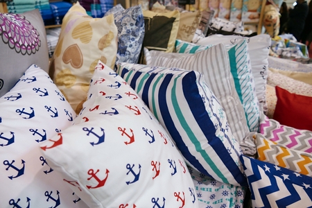 many pillows in a bedroom for a relaxation