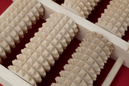 a detail of a wooden massage toolの写真素材