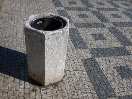 a grey concrete litter bin in city centerの写真素材
