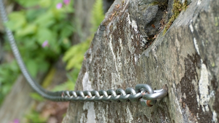 protection chain fixed on a rock routeの写真素材