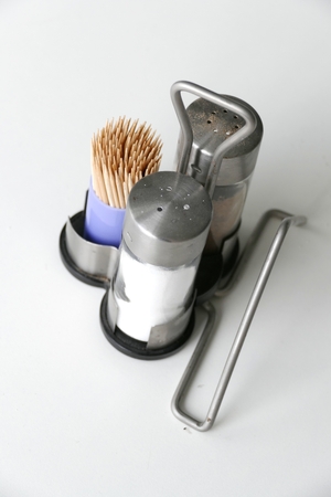 decorative salt and pepper spices served on a tableの写真素材