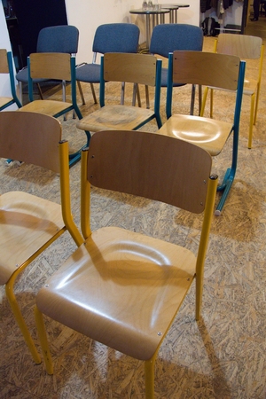 a row of chairs prepared for audience