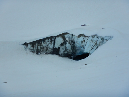 danger crevasses and seracs on a glacier in the alps