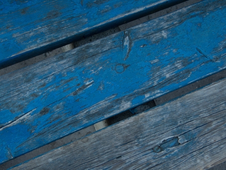 a close  detail of an old blue plank texture
