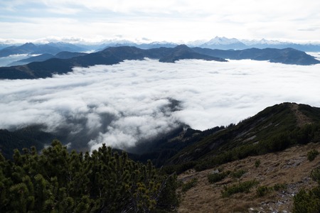 beautiful autumn hiking in berchtesgadener alps with fog in the valey and stunning viewsの写真素材