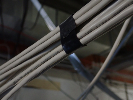    unorganised mess of electrical wires on a building site