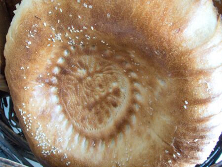 a detail of a typical round uzbek bread in a market