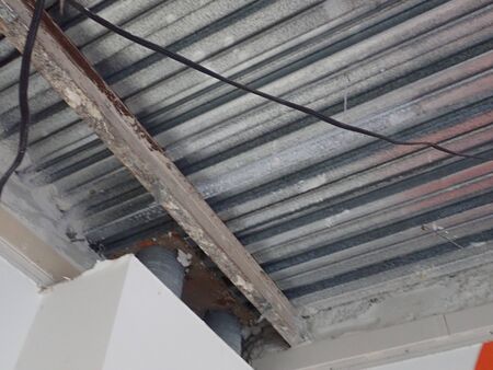 undustrial  metal ceiling and roof on beams uncovered