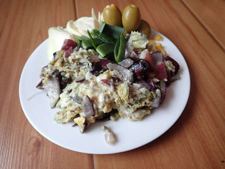 portion of scrambled eggs with various vegetablesの写真素材