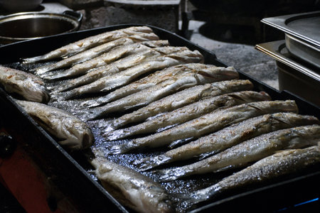 fish barbecue on a huge grill for a festaの写真素材