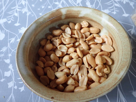 roasted salted peanuts in a bowl on a table