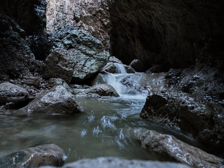 pure wild river with waterfalls in the mountains