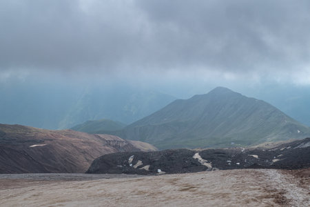 amazing nature climbing Mount Kazbeg in Georgia in summerの写真素材
