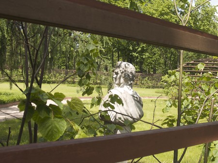 Espalier and sculpture in summer sunny parkの写真素材